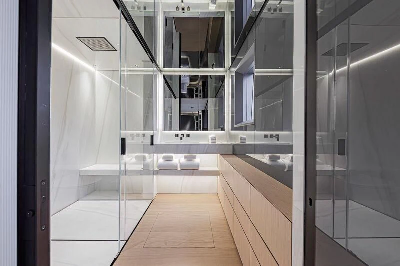 a bathroom with a large mirror aboard ACE Yacht for Sale