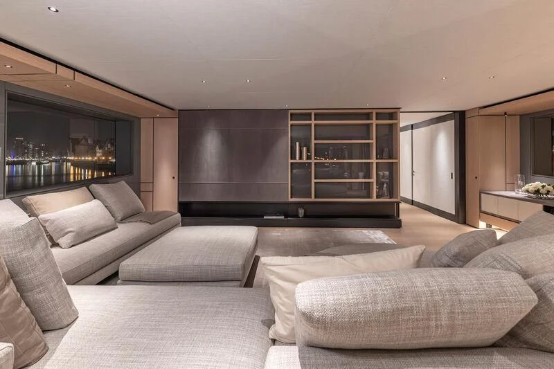 a living room with a large tv aboard ACE Yacht for Sale