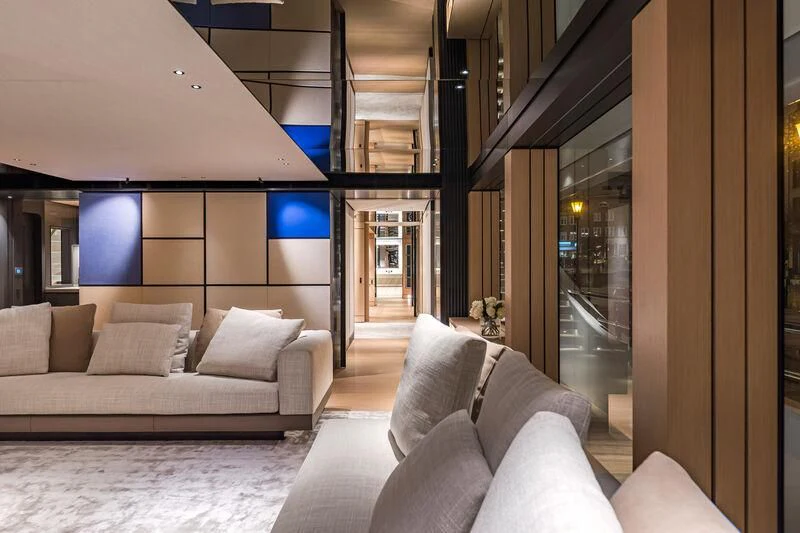 a room with a couch and a table aboard ACE Yacht for Sale