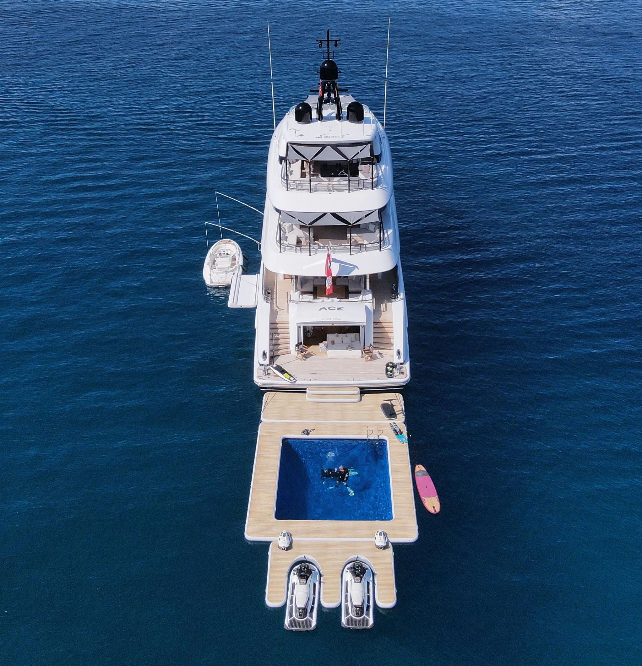a white and red ship in the water aboard ACE Yacht for Sale