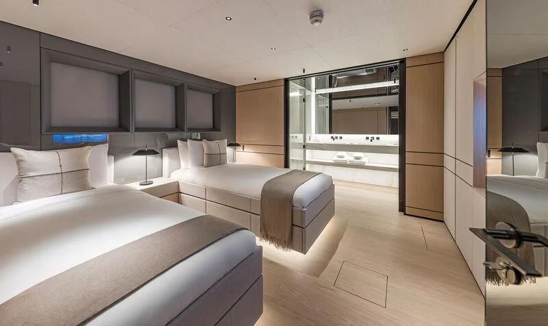 a room with a bed and a tv aboard ACE Yacht for Sale