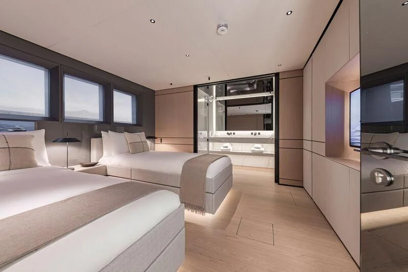 a room with a bed and a tv aboard ACE Yacht for Sale