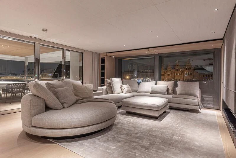 a living room with a large window aboard ACE Yacht for Sale