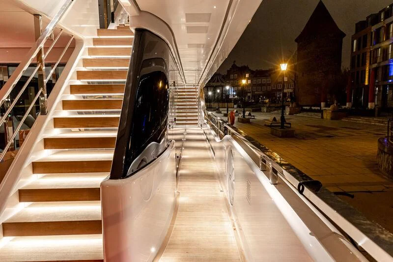 a large staircase in a building aboard ACE Yacht for Sale