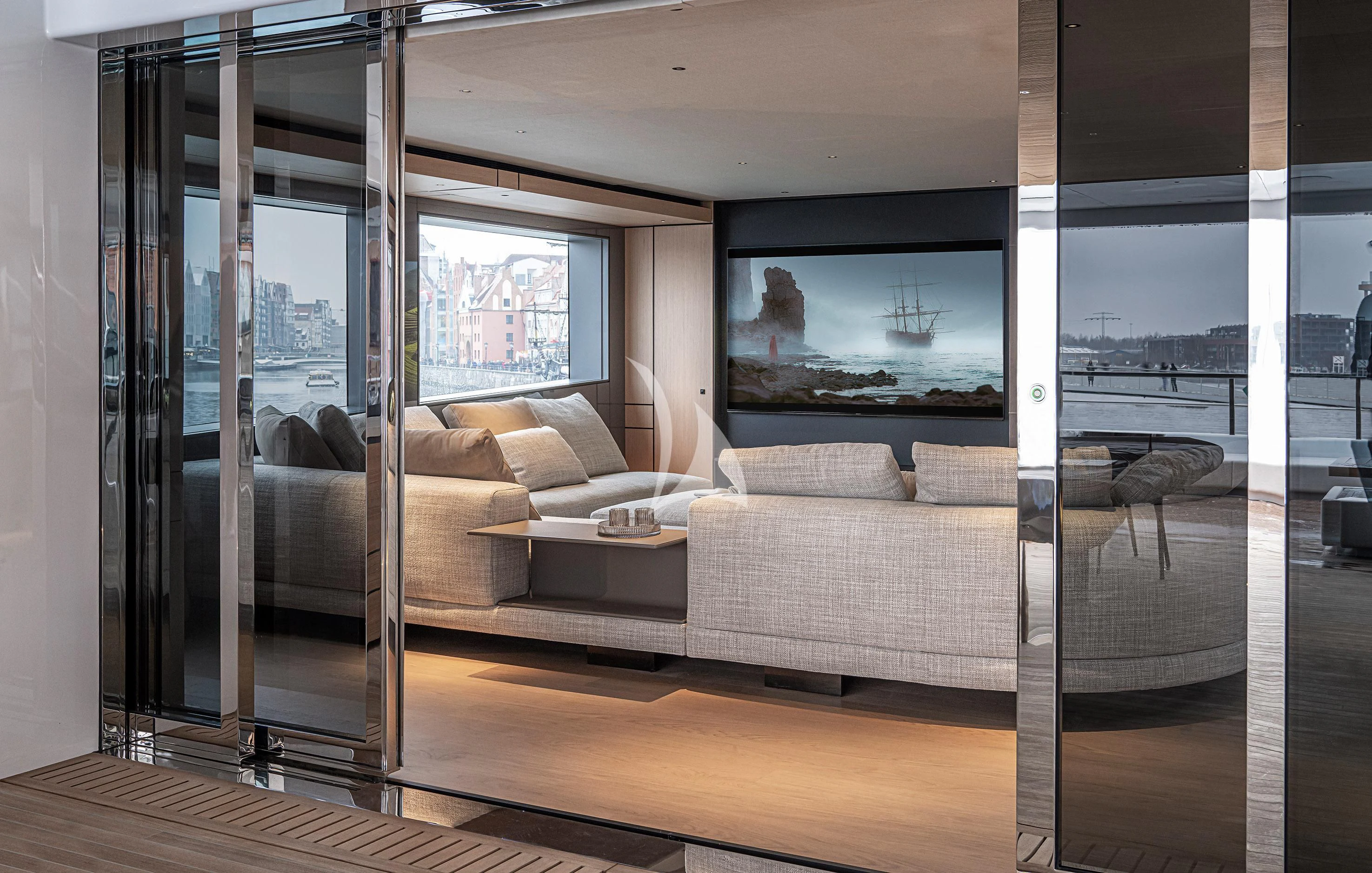 a living room with a large glass door aboard ACE Yacht for Sale