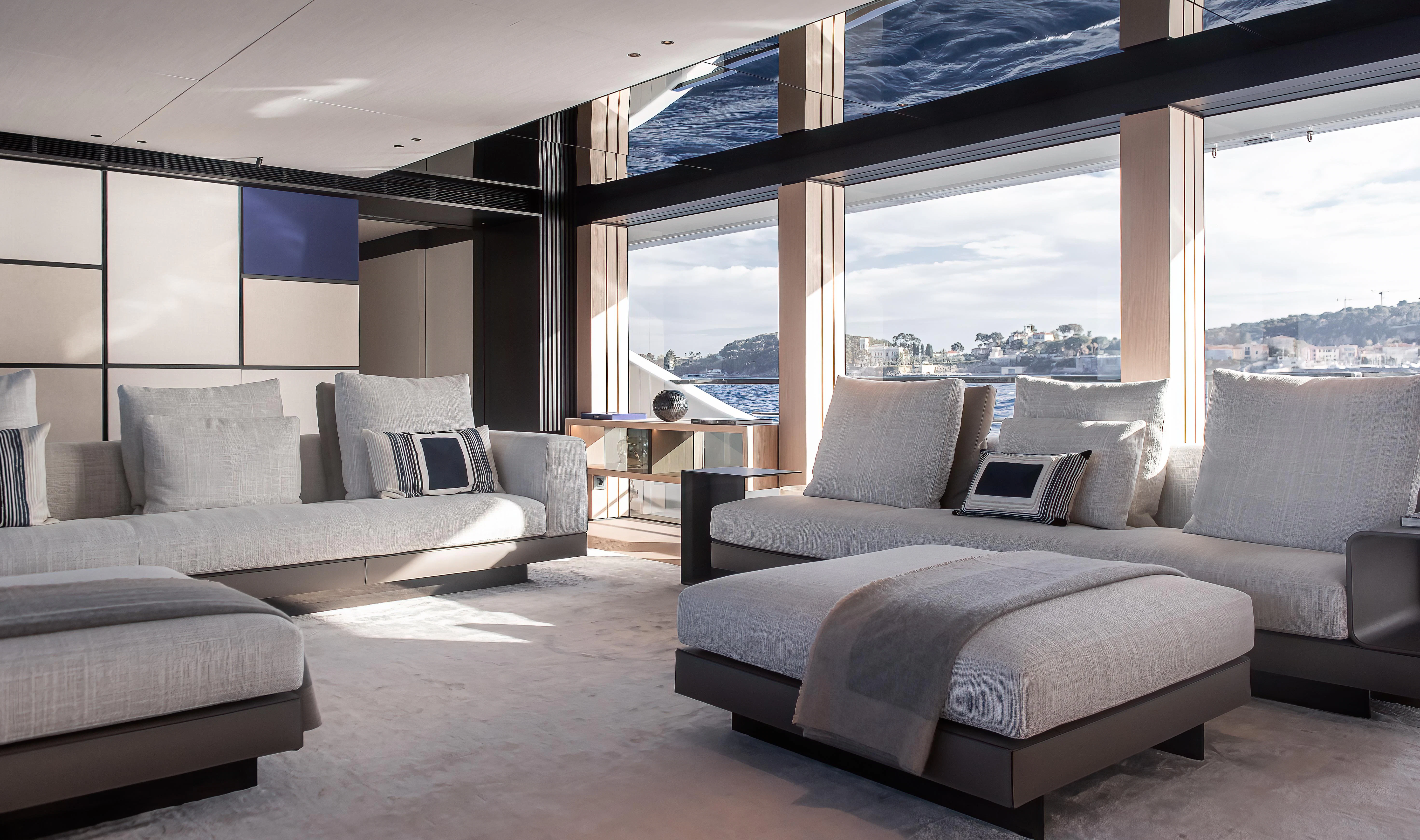 a room with a bed and a couch aboard ACE Yacht for Sale