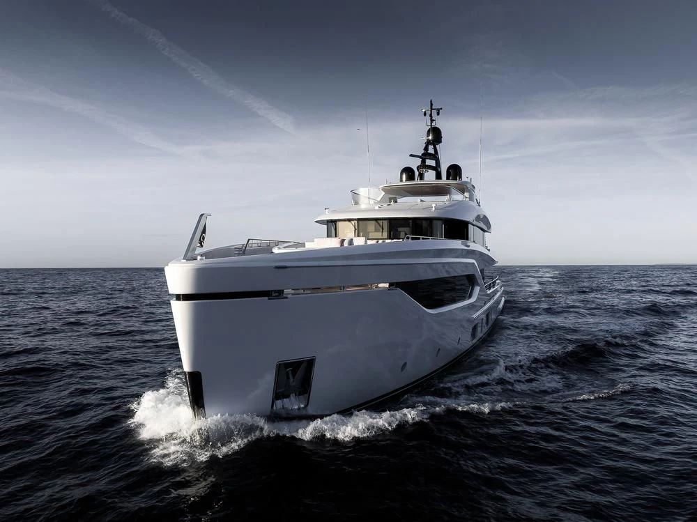 a white yacht in the water aboard ACE Yacht for Sale