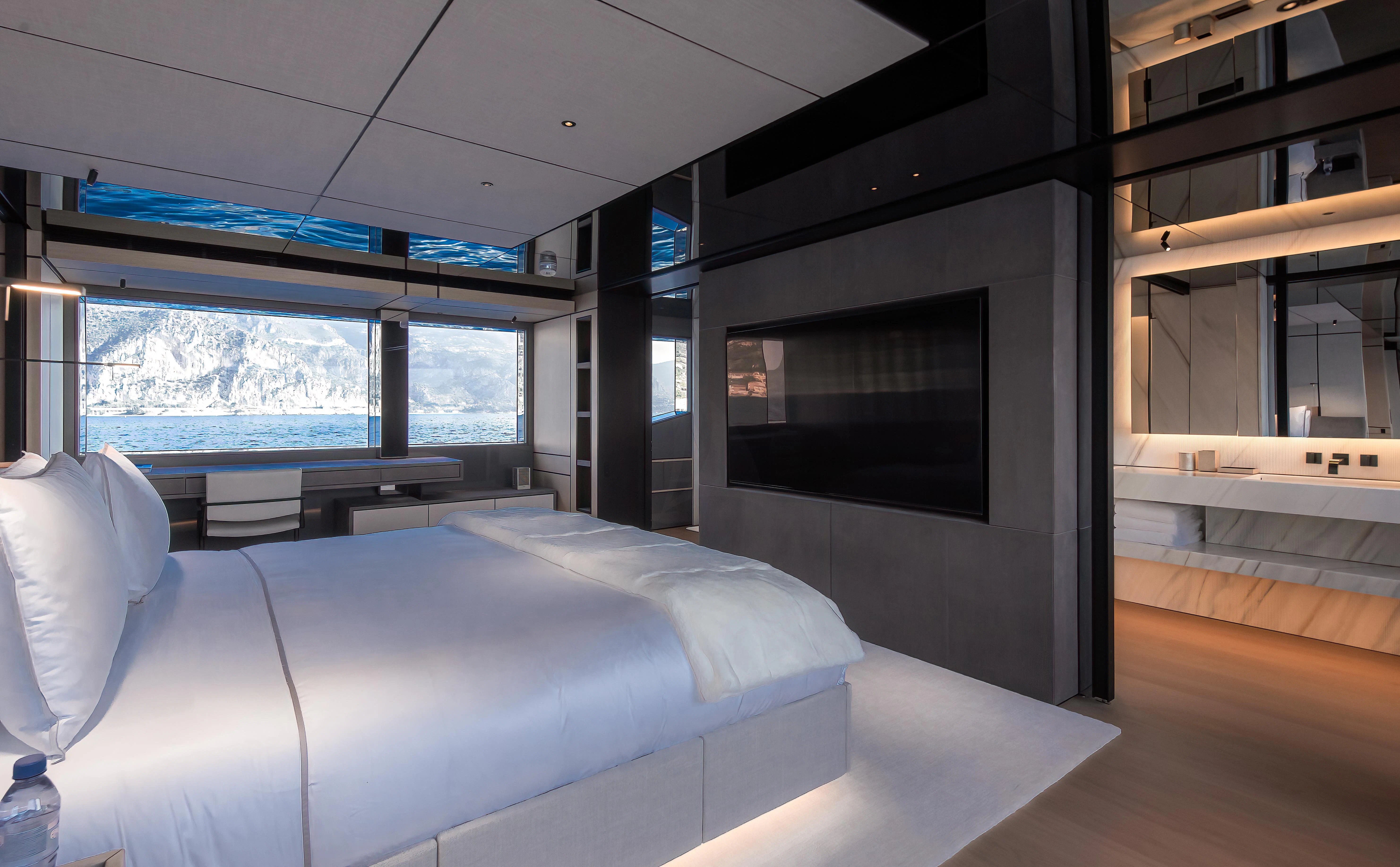 a room with a bed and a tv aboard ACE Yacht for Sale