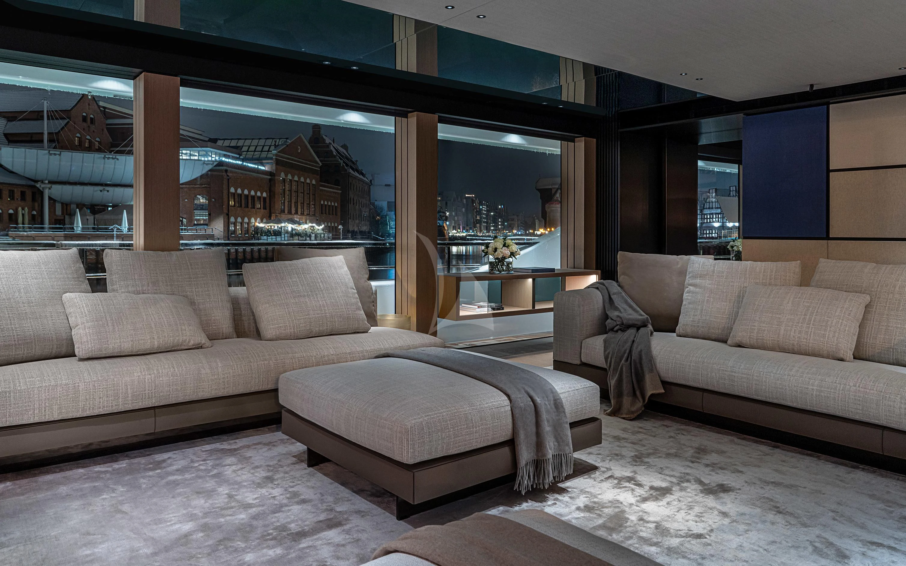 a living room with couches aboard ACE Yacht for Sale