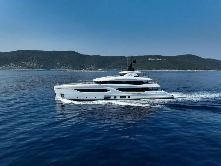 a white boat on the water aboard ACE Yacht for Sale