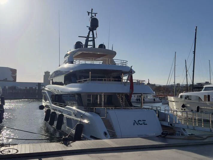a boat docked at a pier aboard ACE Yacht for Sale