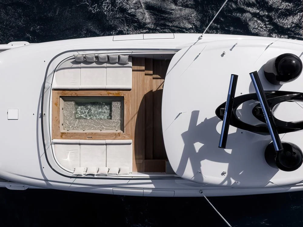 a white vehicle with a door and a satellite dish on the side aboard ACE Yacht for Sale