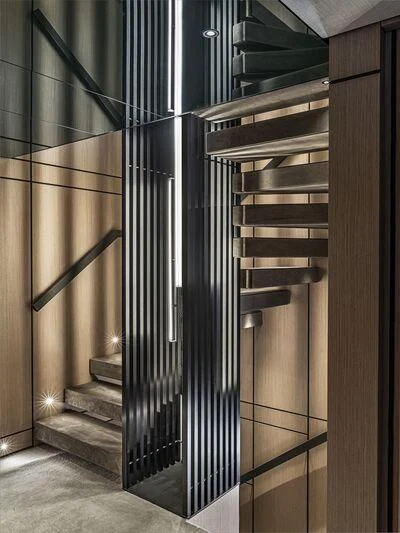 a black and silver staircase aboard ACE Yacht for Sale