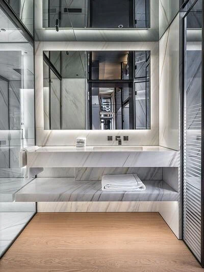 a white bench in a room aboard ACE Yacht for Sale