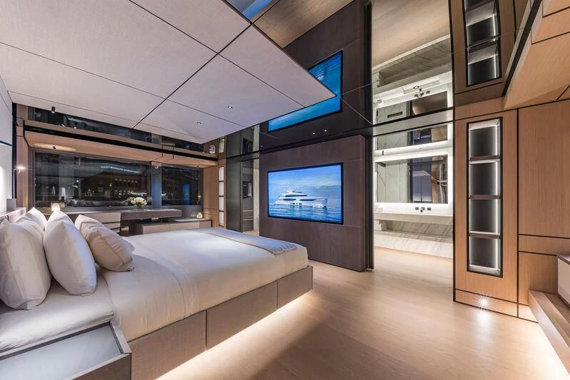 a room with a couch and a tv aboard ACE Yacht for Sale