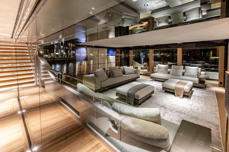 a large room with a couch and a table aboard ACE Yacht for Sale
