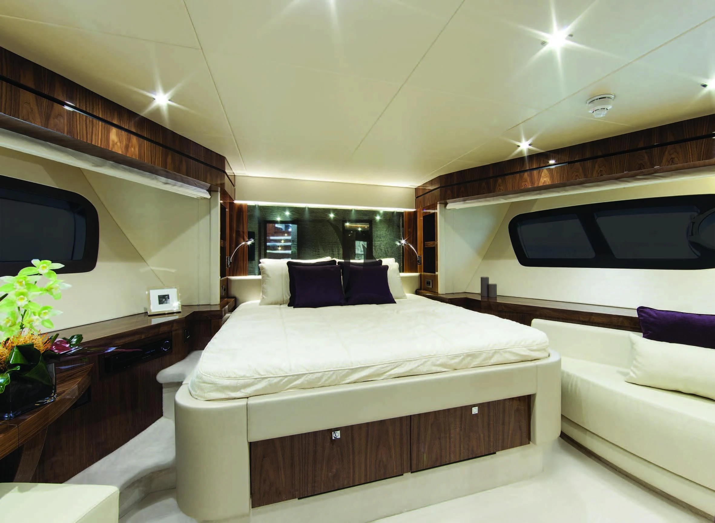 a room with a bed and a couch aboard HIGH ENERGY Yacht for Sale