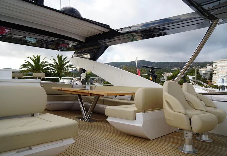 a room with a table and chairs aboard HIGH ENERGY Yacht for Sale