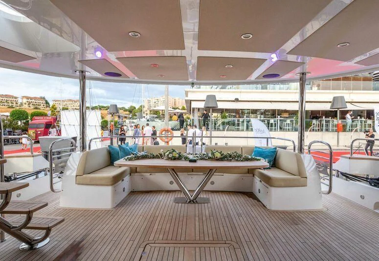 a large room with a table and chairs aboard HIGH ENERGY Yacht for Sale