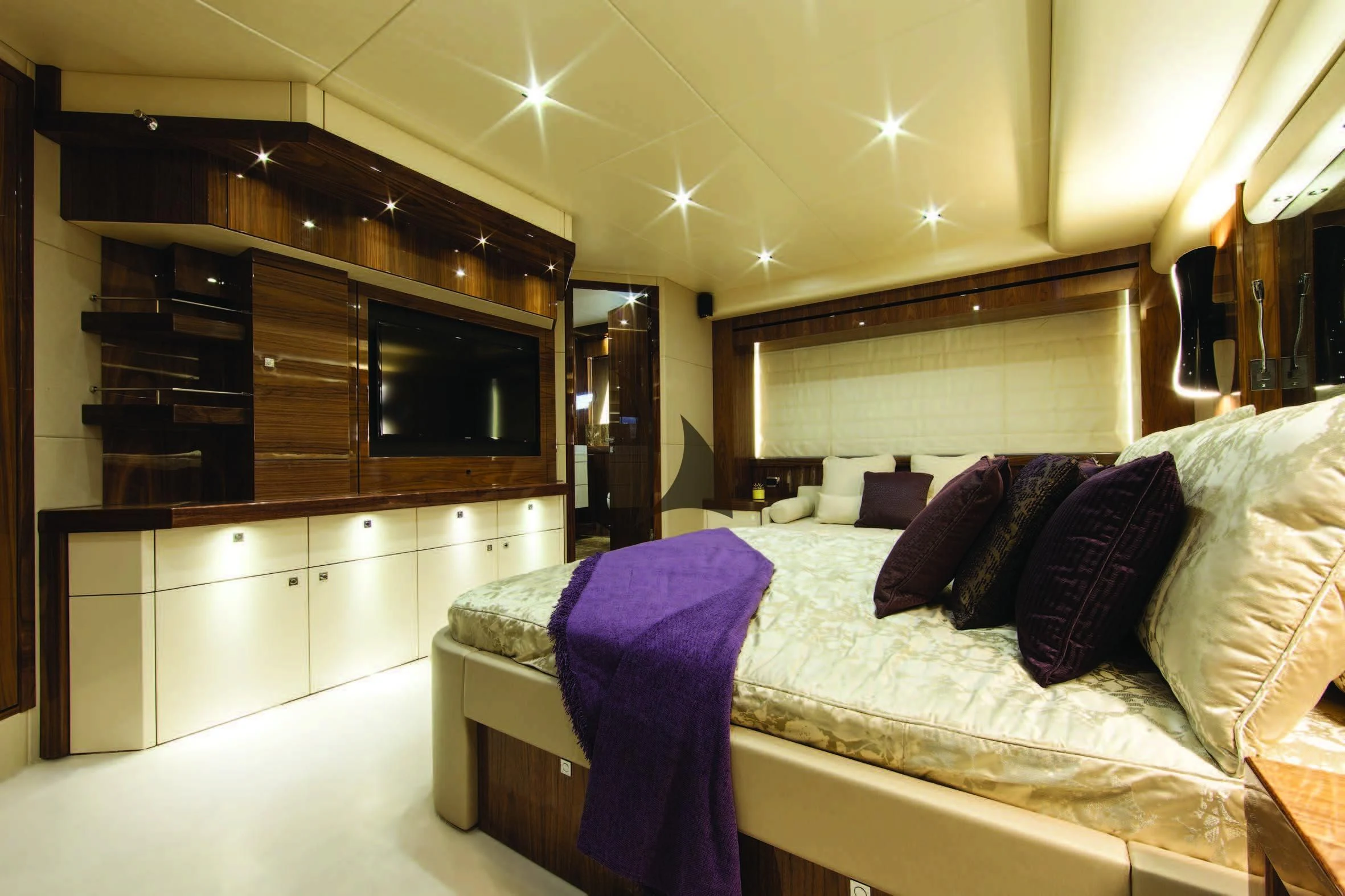 a bedroom with a bed and a tv aboard HIGH ENERGY Yacht for Sale