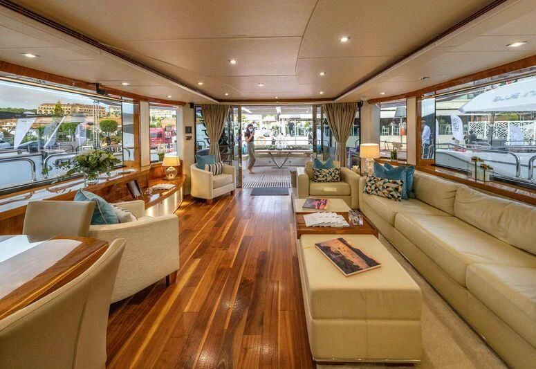 a living room with a wood floor aboard HIGH ENERGY Yacht for Sale