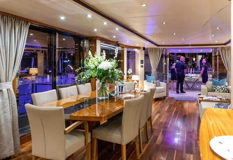 a dining room with a table and chairs aboard HIGH ENERGY Yacht for Sale