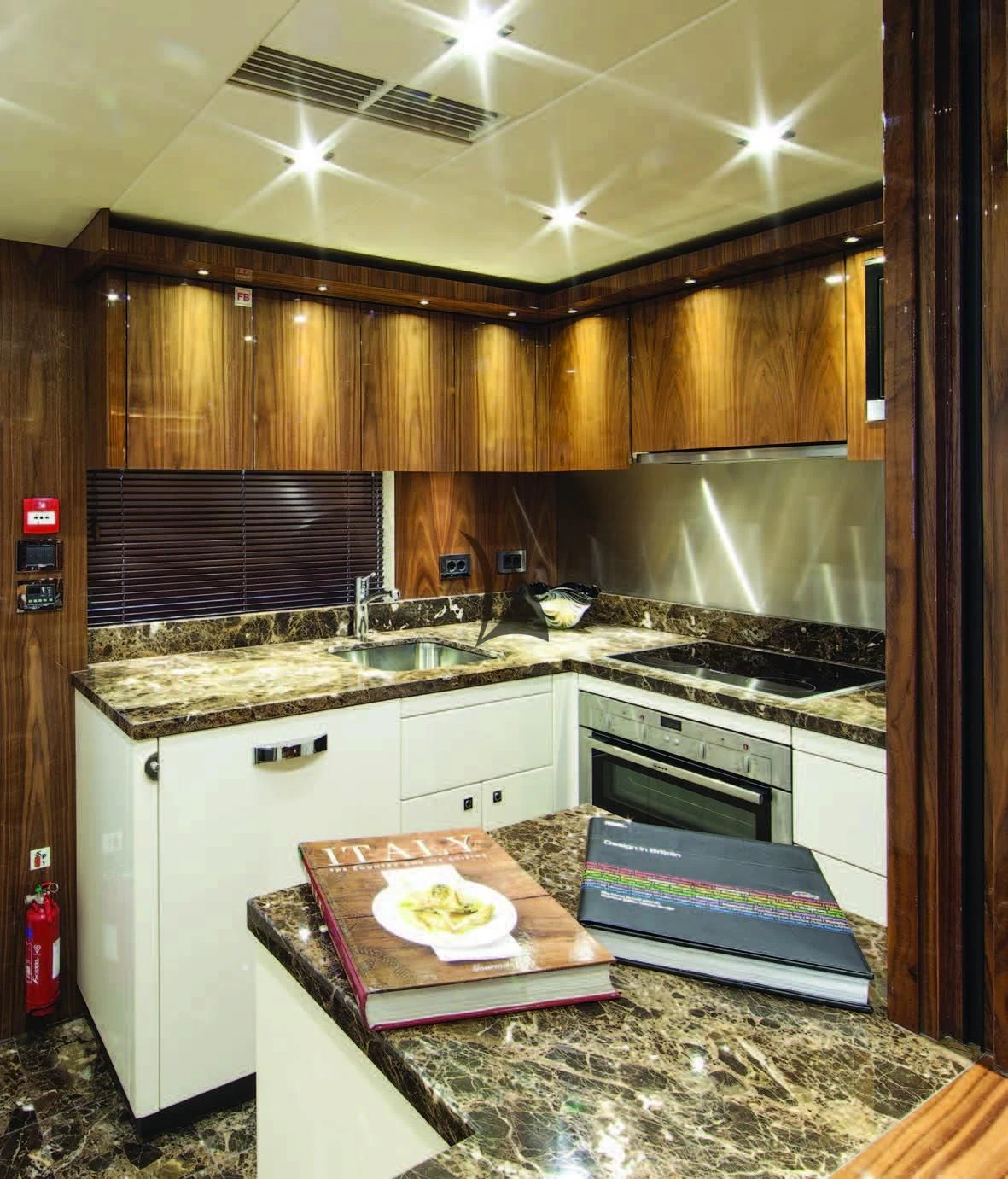 a kitchen with wooden cabinets aboard HIGH ENERGY Yacht for Sale