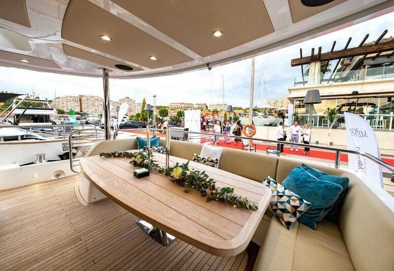 a large room with a table and chairs aboard HIGH ENERGY Yacht for Sale