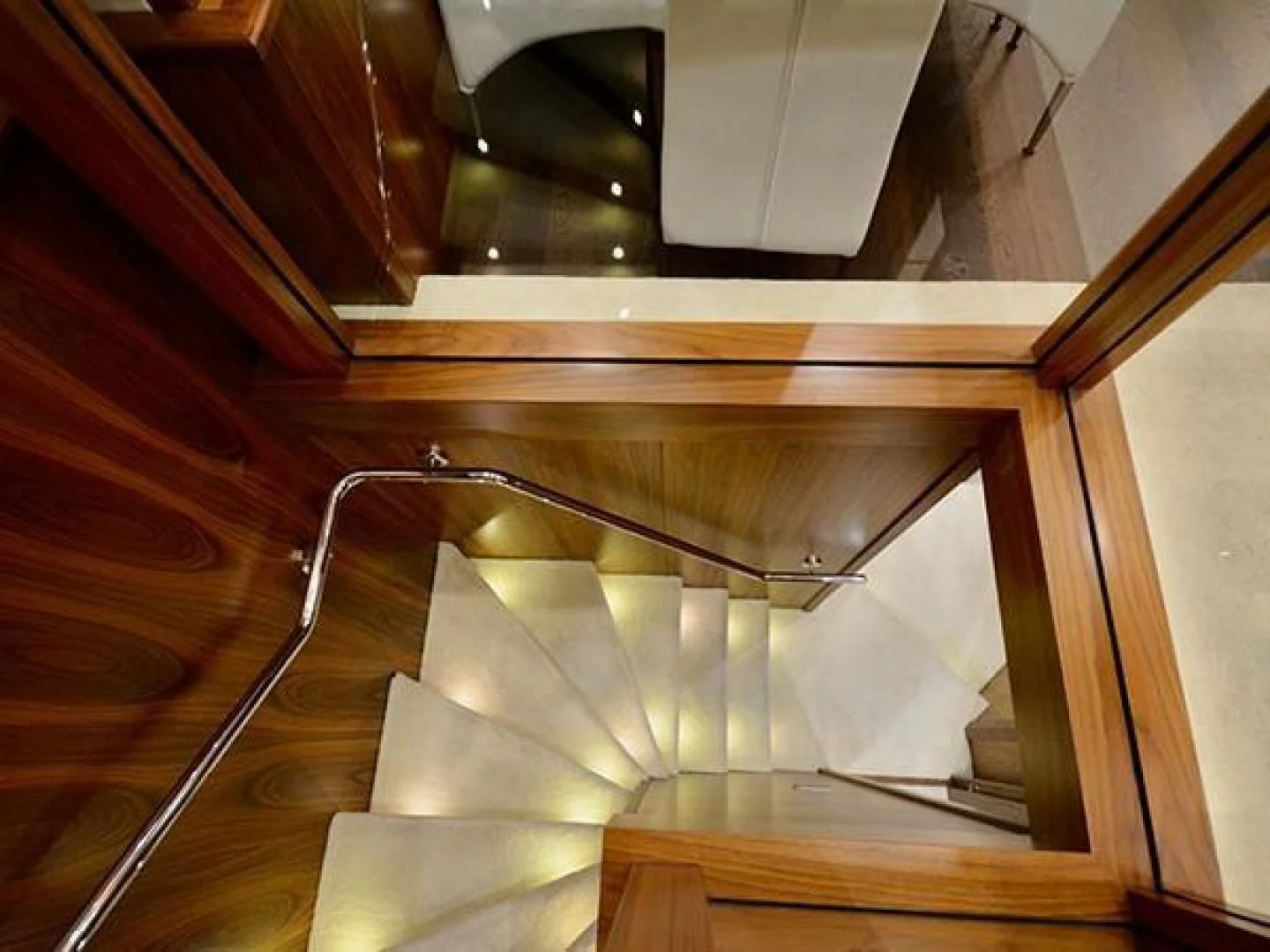 a spiral staircase with a railing aboard EXIMIUS Yacht for Sale