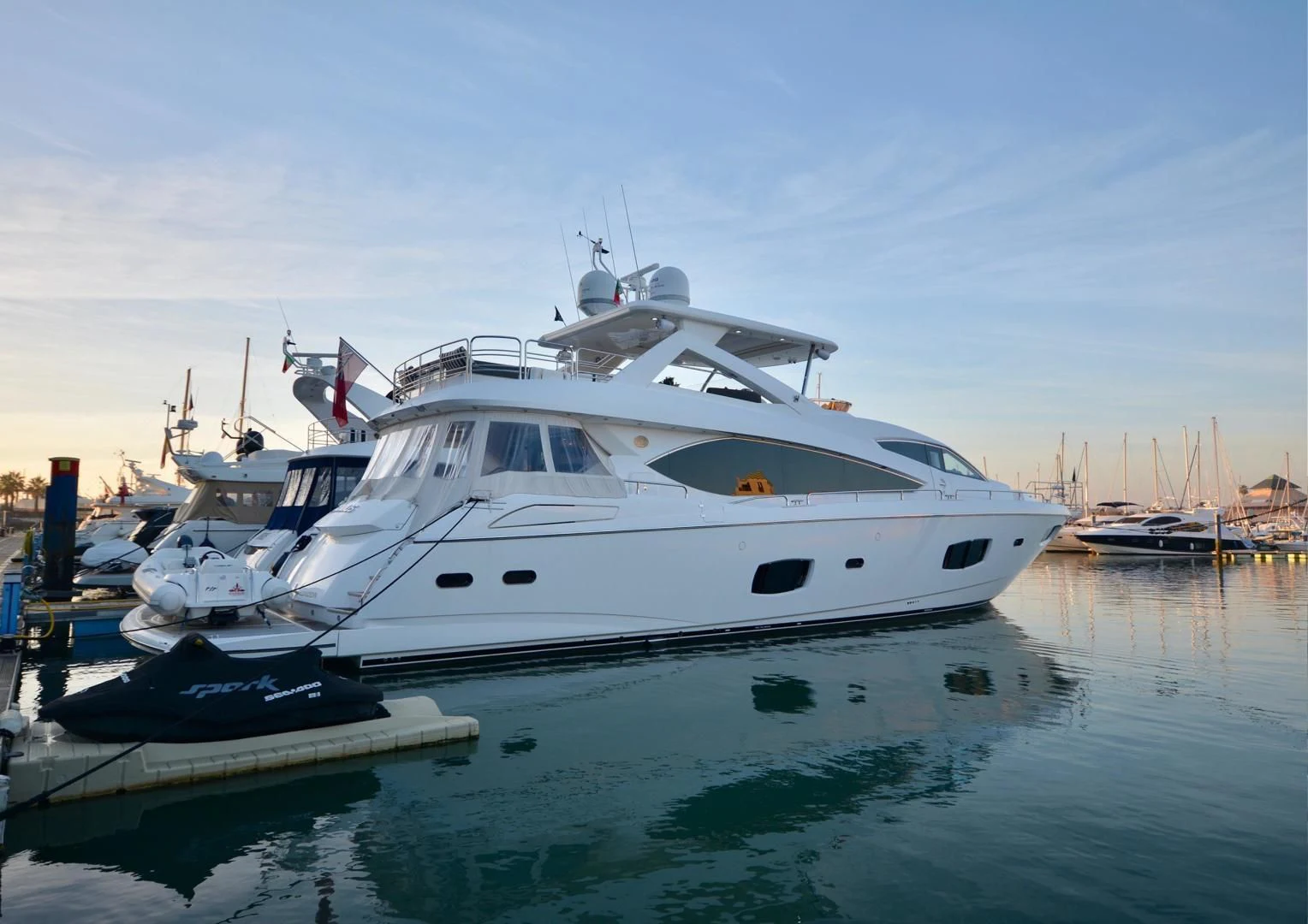 a group of boats in a harbor aboard EXIMIUS Yacht for Sale