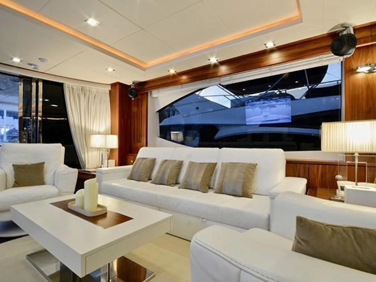 a living room with a large screen aboard EXIMIUS Yacht for Sale