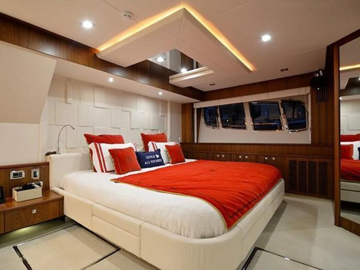 a bedroom with a bed and a desk aboard EXIMIUS Yacht for Sale