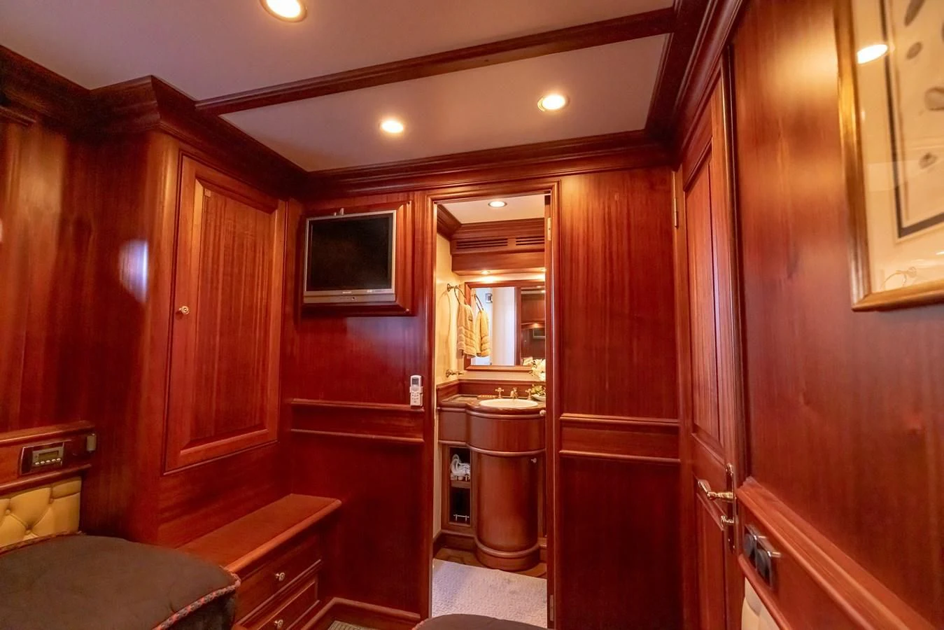 a room with wooden cabinets aboard 85 CLASSIC Yacht for Sale