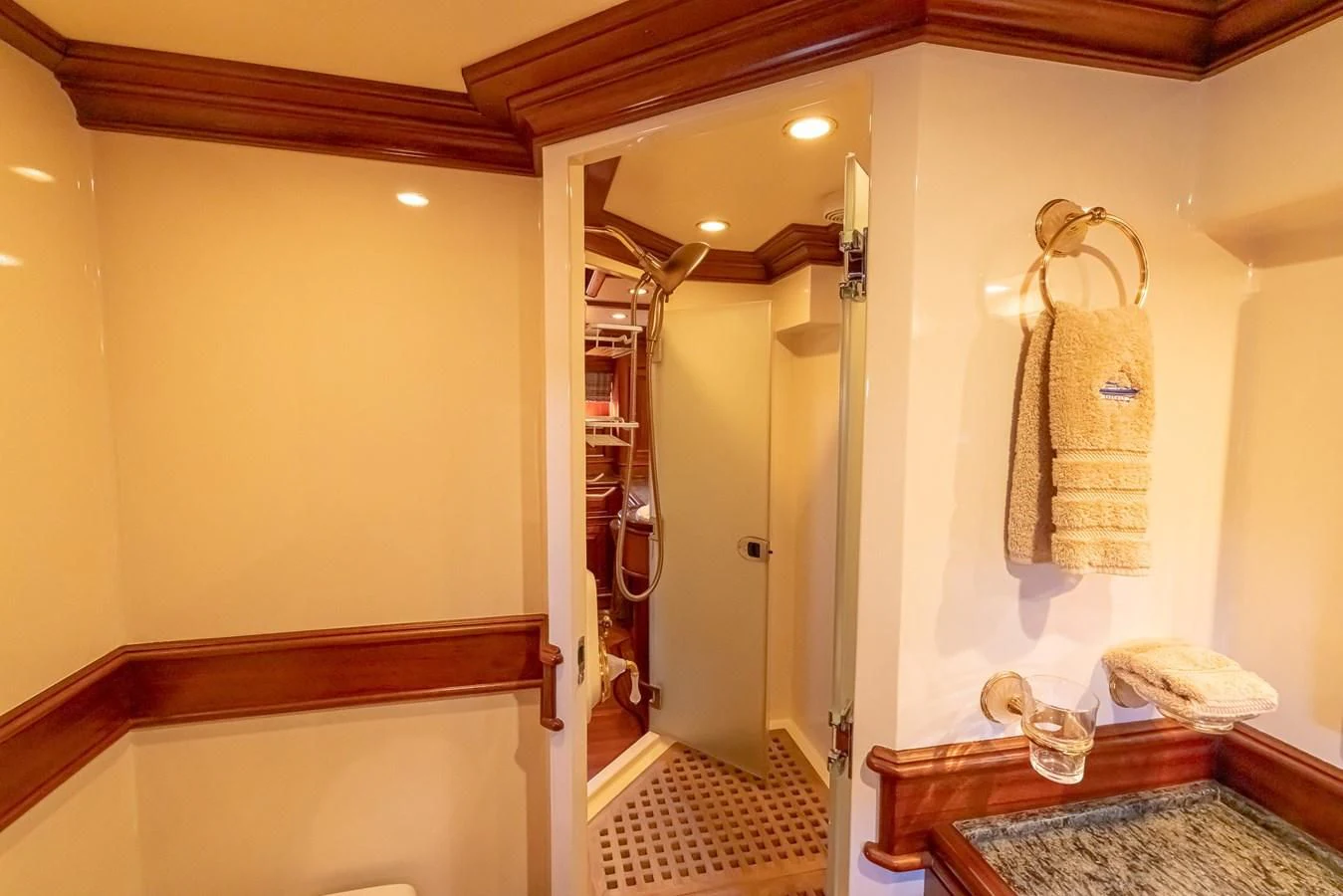 a bathroom with a shower unit and a sink aboard 85 CLASSIC Yacht for Sale
