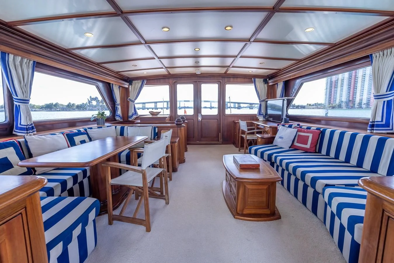 a large room with a couch and a table aboard 85 CLASSIC Yacht for Sale