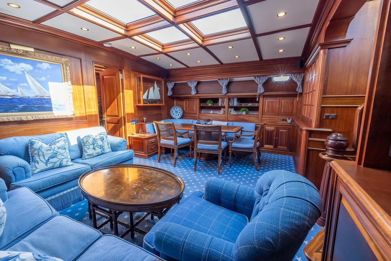 a living room with wood walls aboard 85 CLASSIC Yacht for Sale