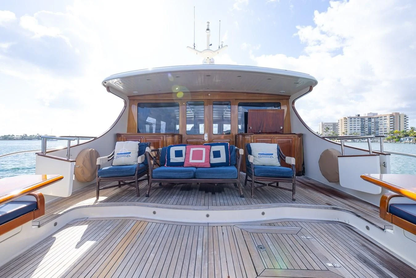 a deck with chairs and a table on it aboard 85 CLASSIC Yacht for Sale
