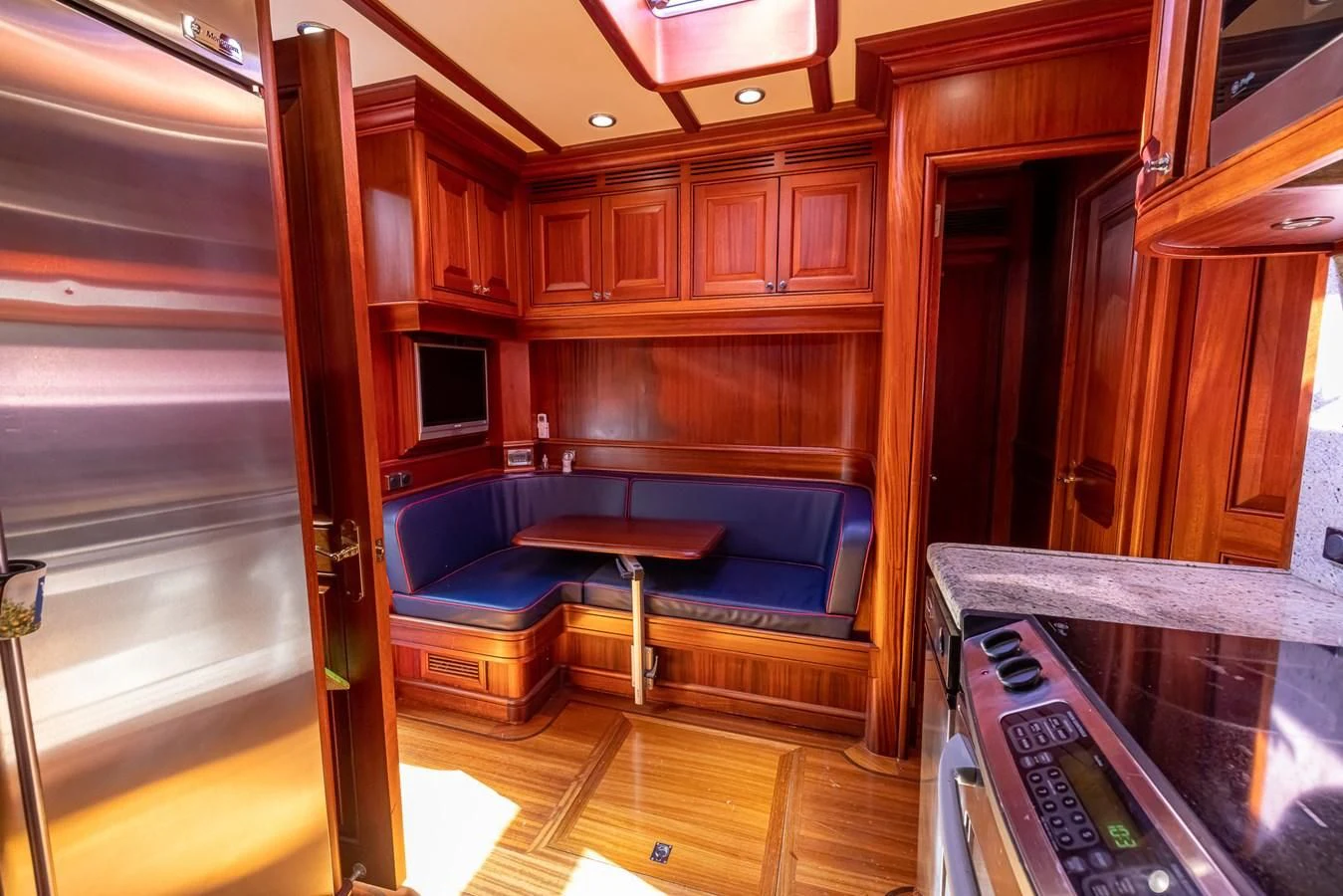 a room with a bed and a table aboard 85 CLASSIC Yacht for Sale