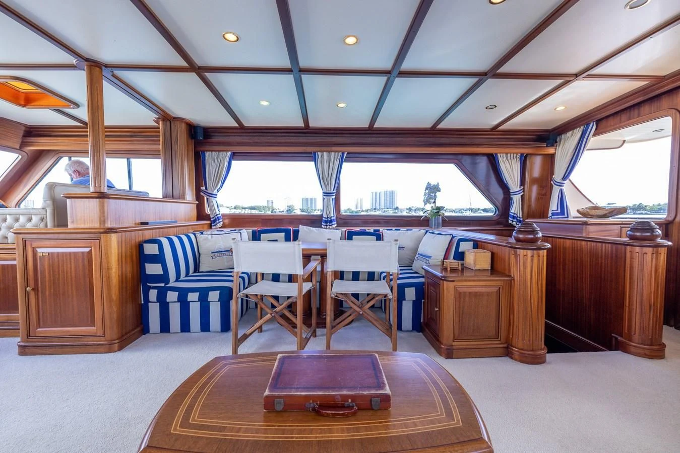 a room with a table and chairs aboard 85 CLASSIC Yacht for Sale