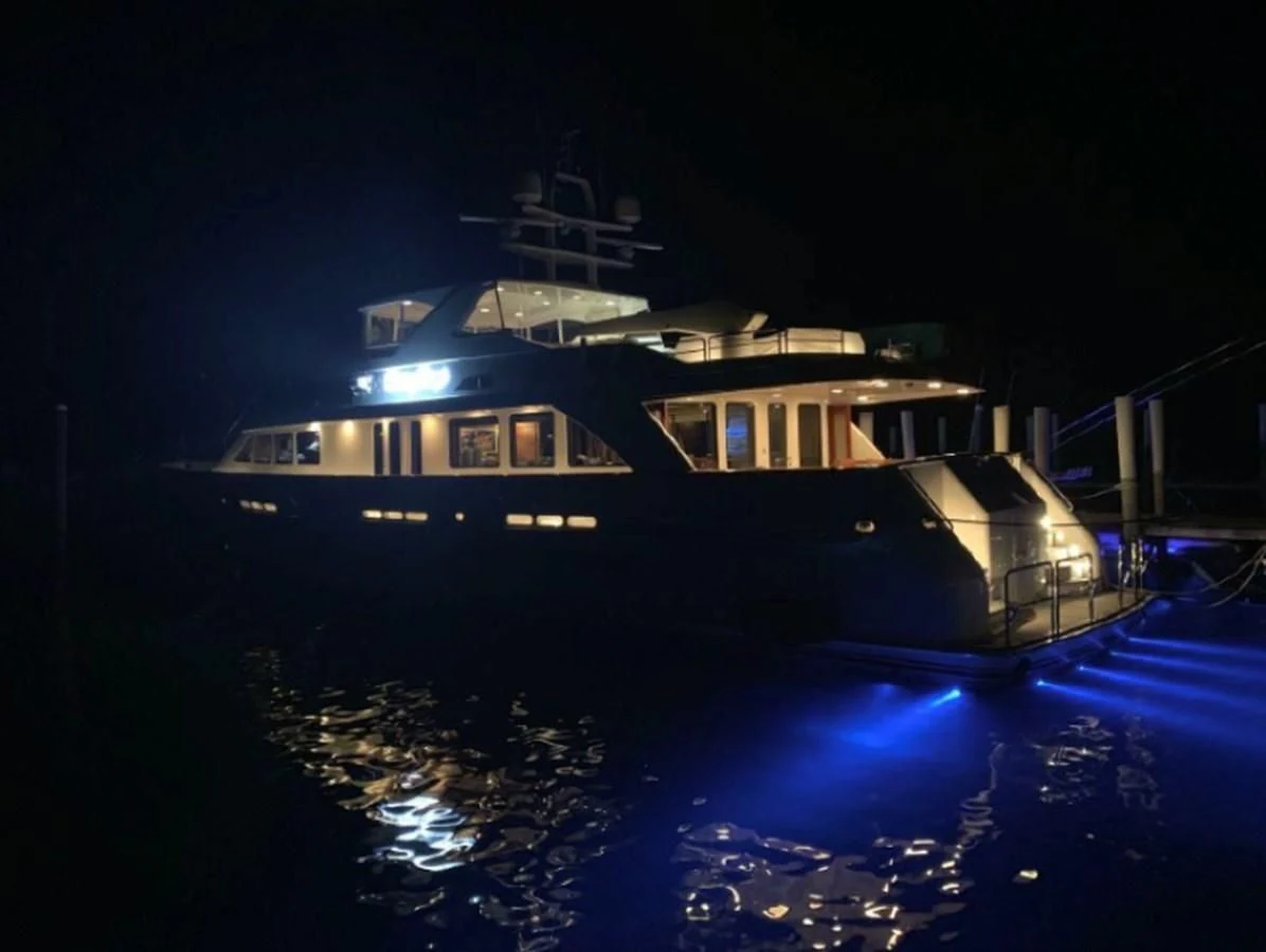 a large boat at night aboard HAU TREE Yacht for Sale