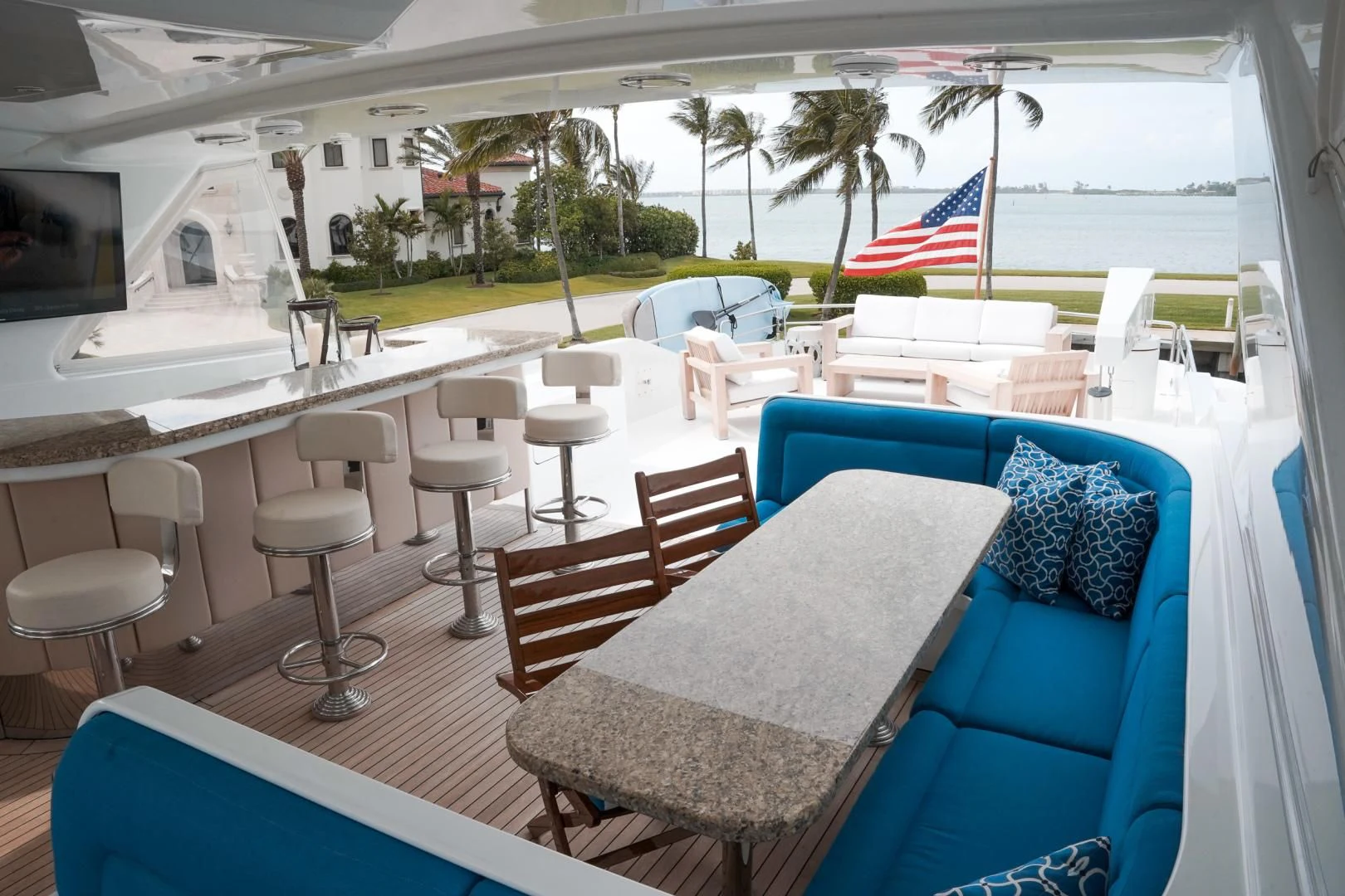 a patio with chairs and tables aboard HAU TREE Yacht for Sale