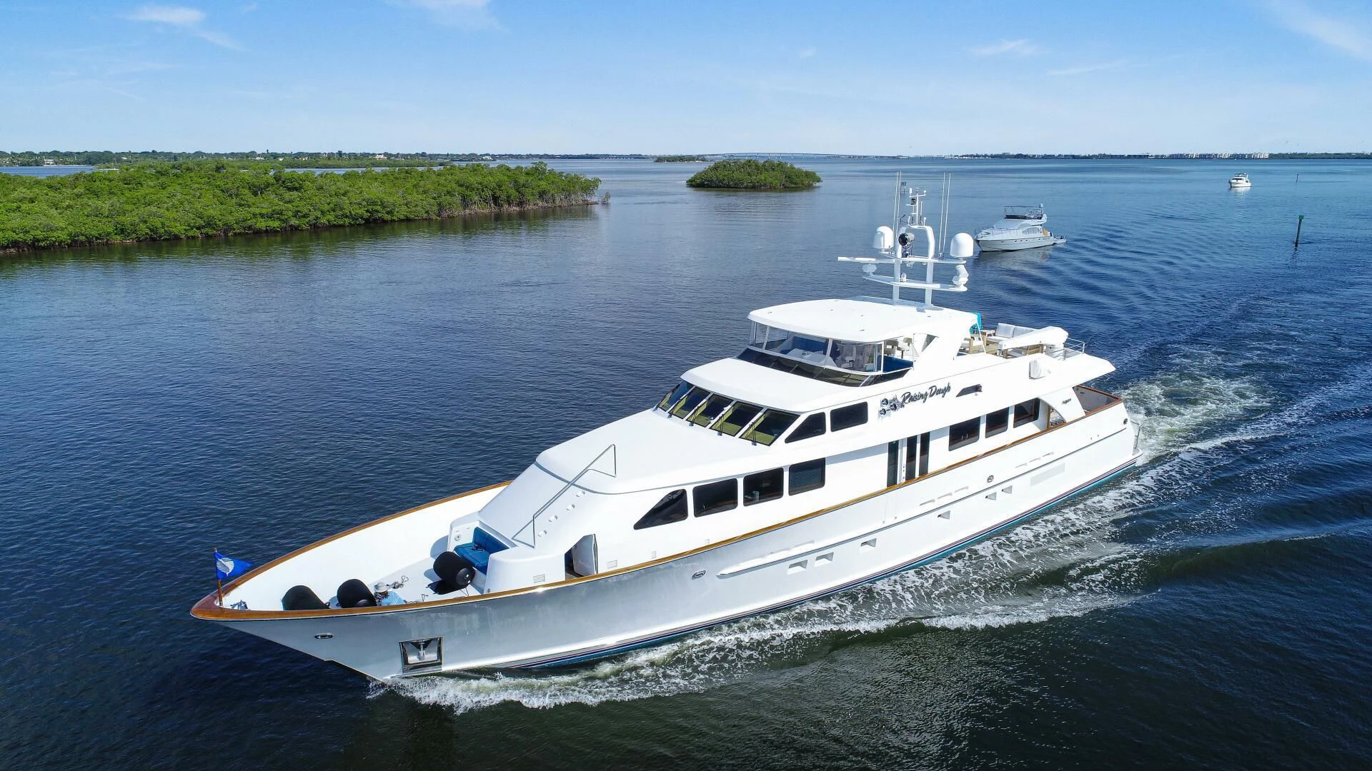 a white boat on the water aboard HAU TREE Yacht for Sale