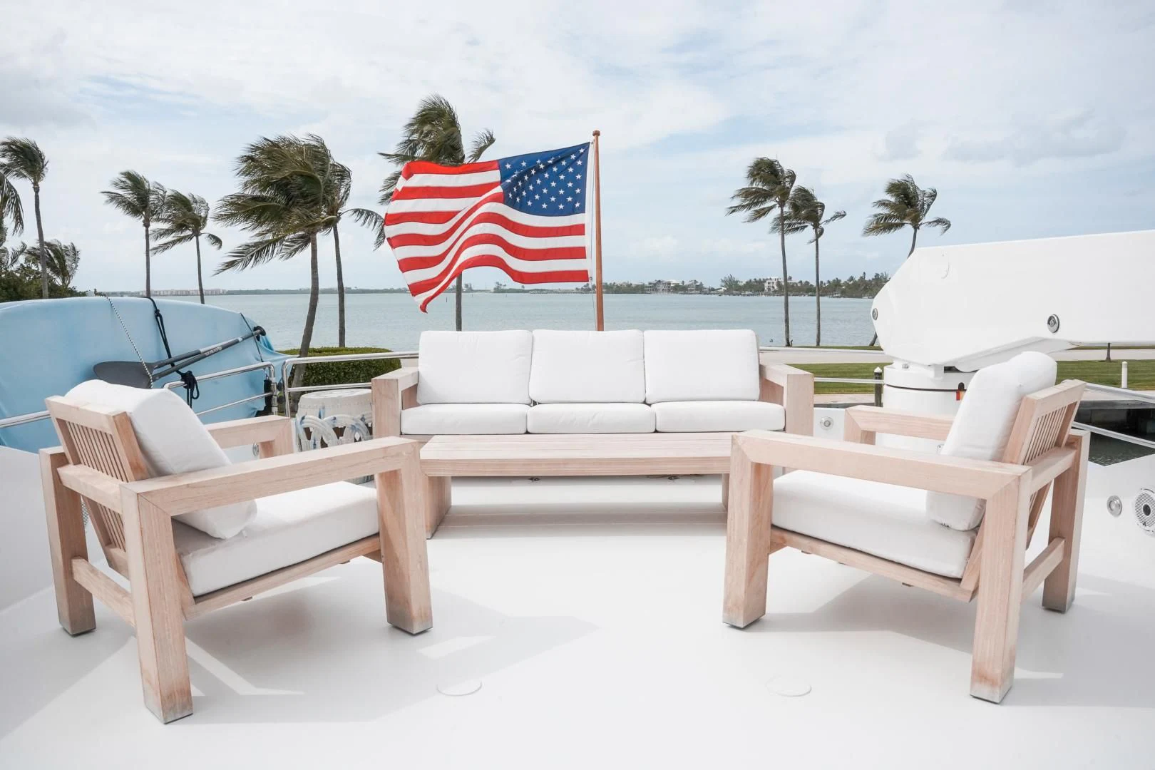 a couple of benches with a flag on them aboard HAU TREE Yacht for Sale