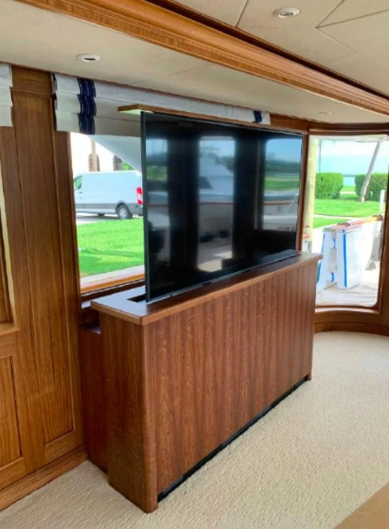 a wood cabinet with a window aboard HAU TREE Yacht for Sale