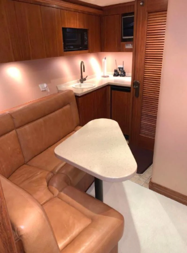 a living room with a couch and a sink aboard HAU TREE Yacht for Sale