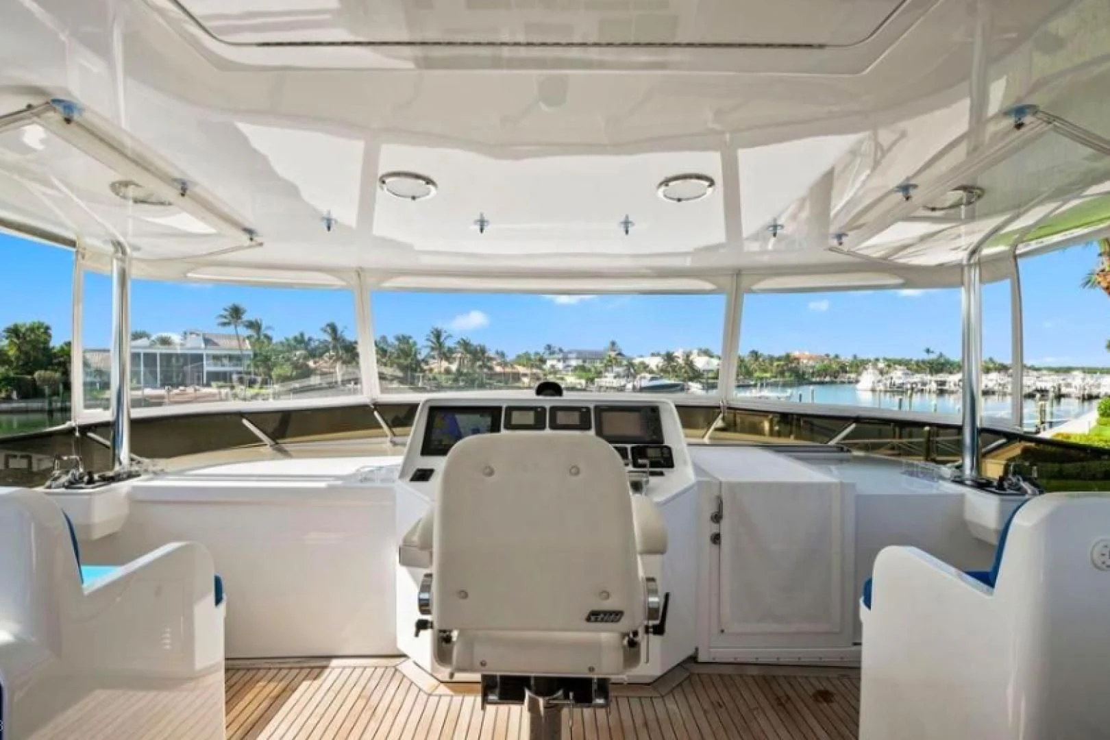 a boat with a chair and a table on it aboard HAU TREE Yacht for Sale