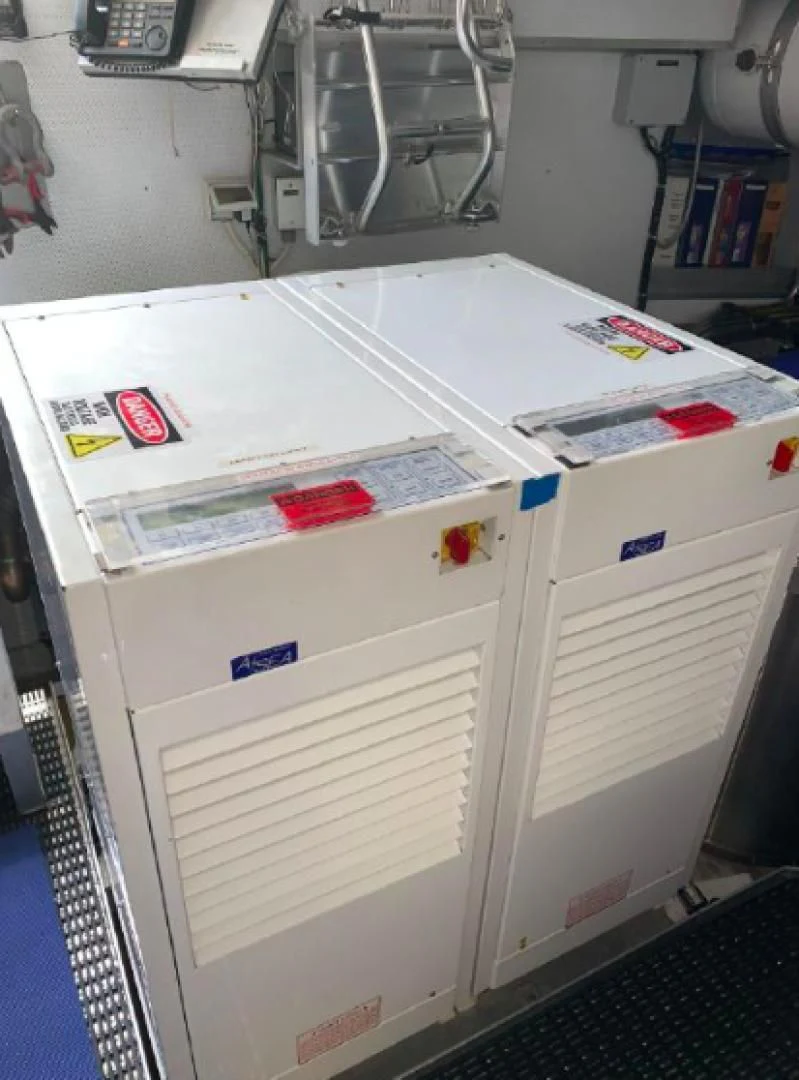 a white refrigerator with magnets on it aboard HAU TREE Yacht for Sale
