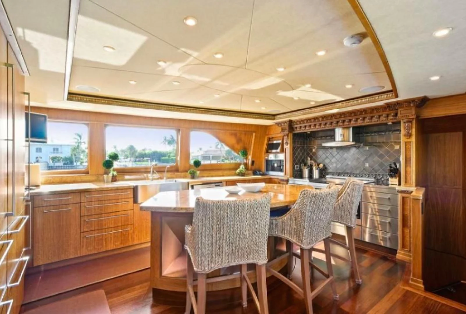 a kitchen with a table and chairs aboard HAU TREE Yacht for Sale