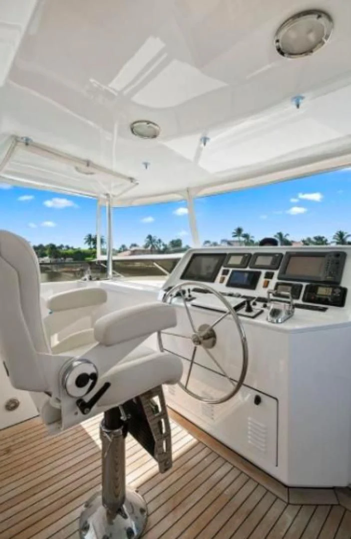 a white car on a wooden deck aboard HAU TREE Yacht for Sale