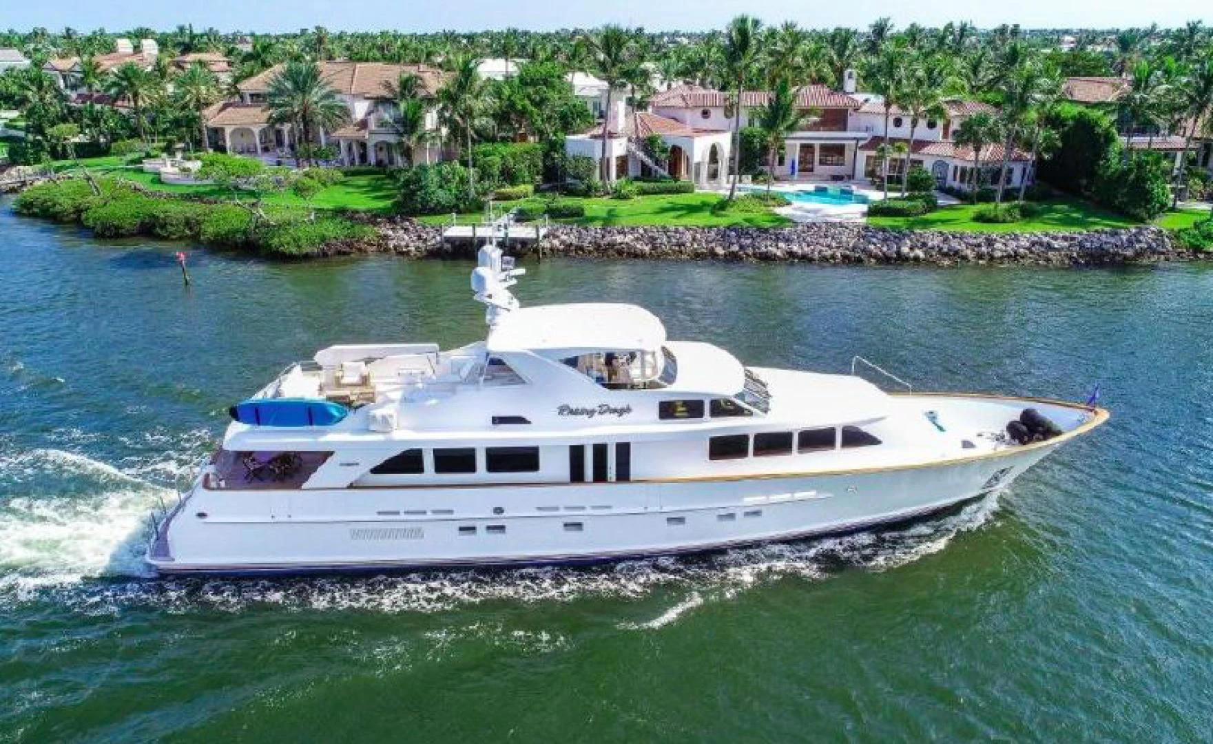 a white boat on the water aboard HAU TREE Yacht for Sale